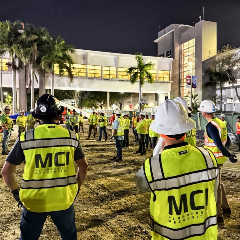 men in MCI gear at a job site